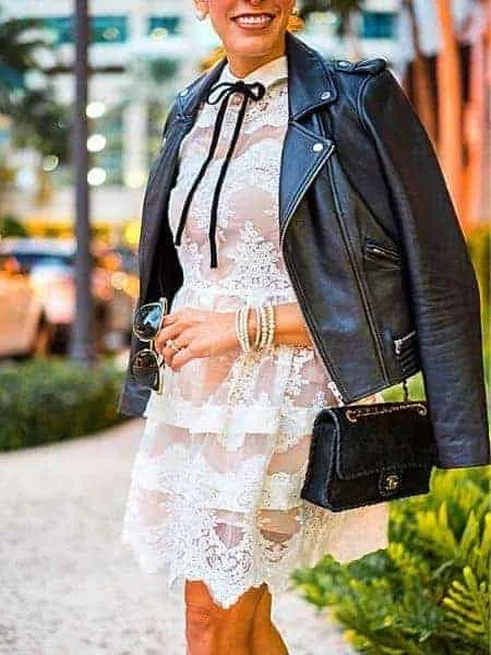 Wear a moto jacket with lace dress in winter