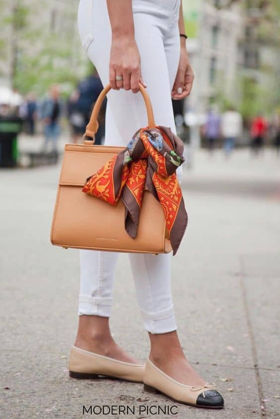 Wear a structured bag with a scarf