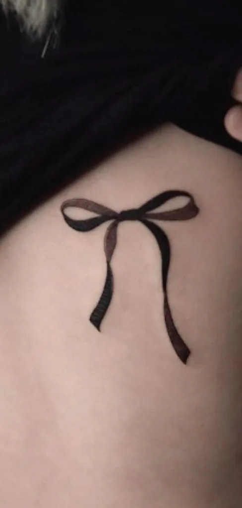 elegant bow tattoo design