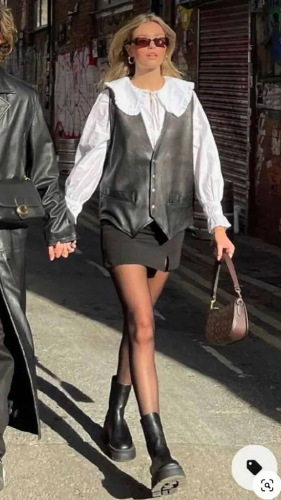 black faux leather vest white blouse