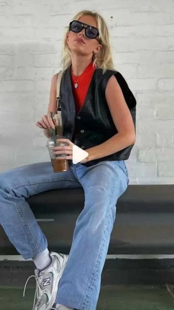 red tee and leather vest outfit idea