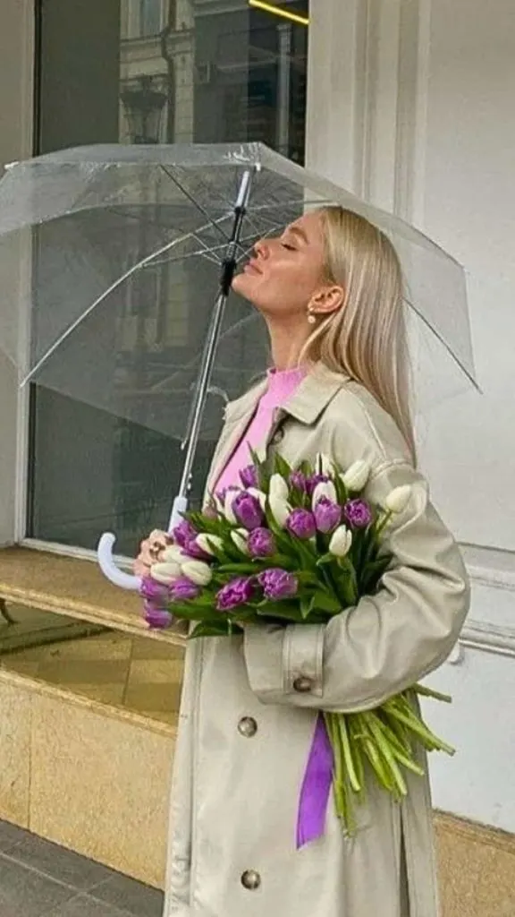 poses with flower bouquet