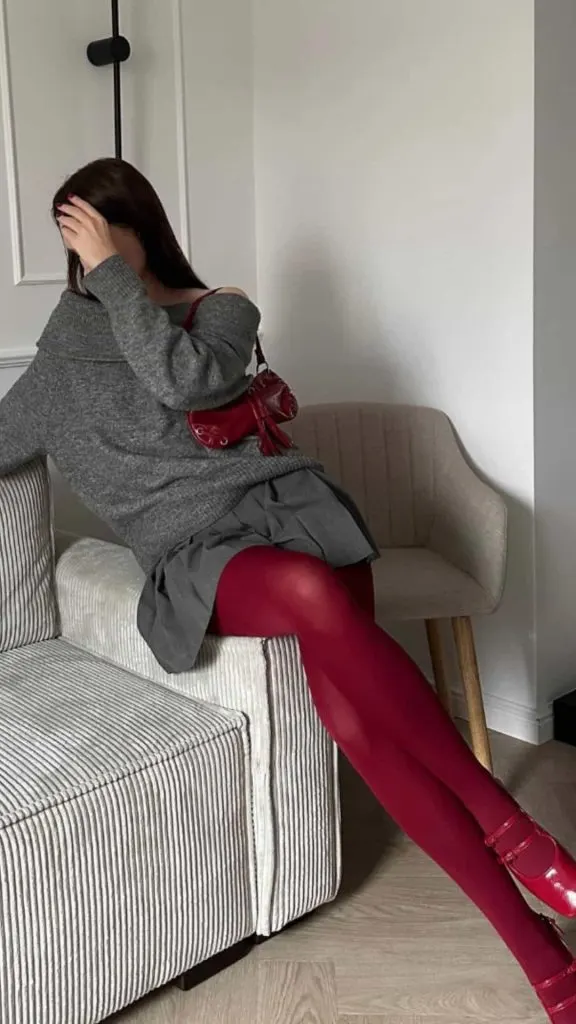 off-shoulder grey top and red tights
