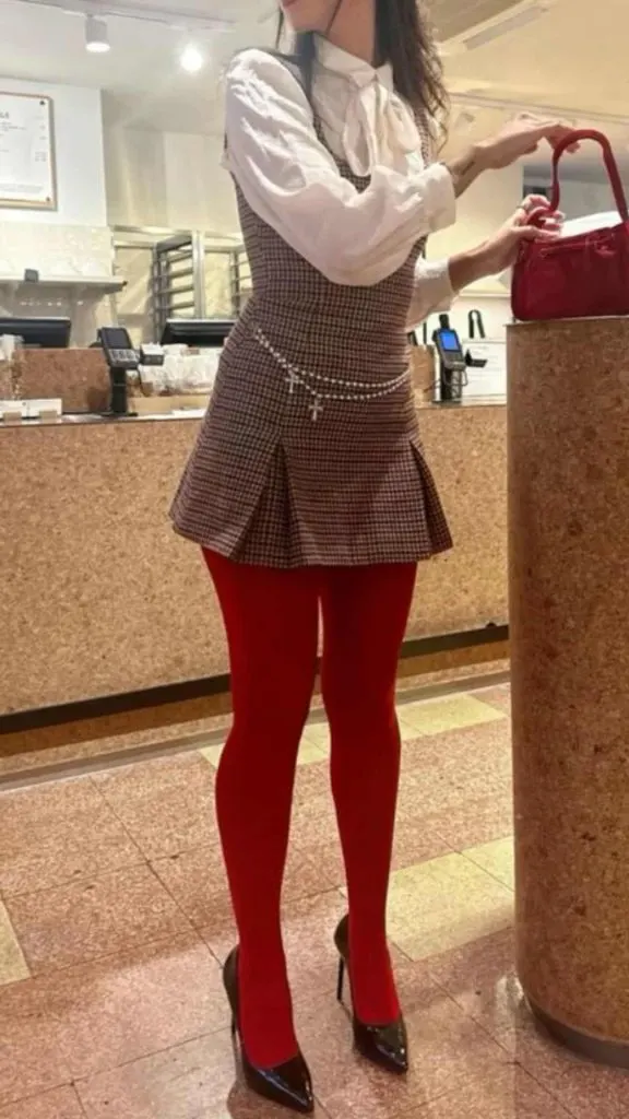 brown checked dress and red tights