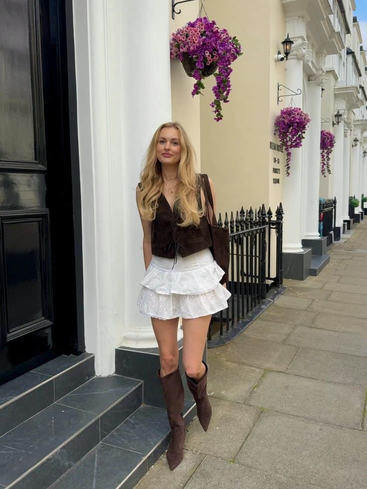 white ruffle skirt and brown boots chic outfit